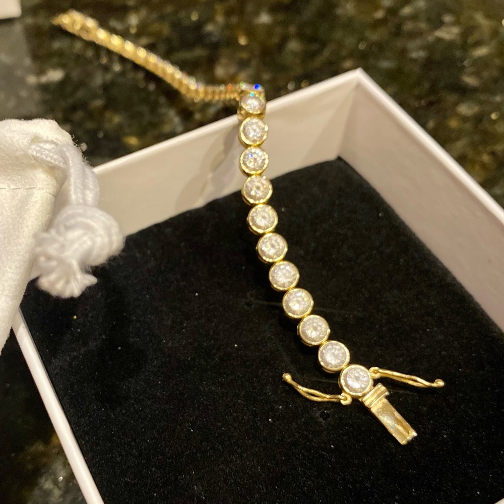 8.75kt Bezel set tennis bracelet. Simulated diamonds, 14kt solid yellow gold